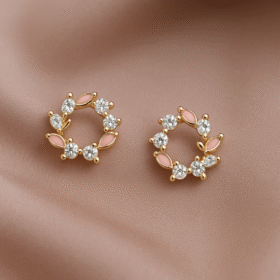 “Circular earrings with crystal petals and pastel enamel blooms exuding soft elegance – Pearl Bloom by Dazzling Pearl.”